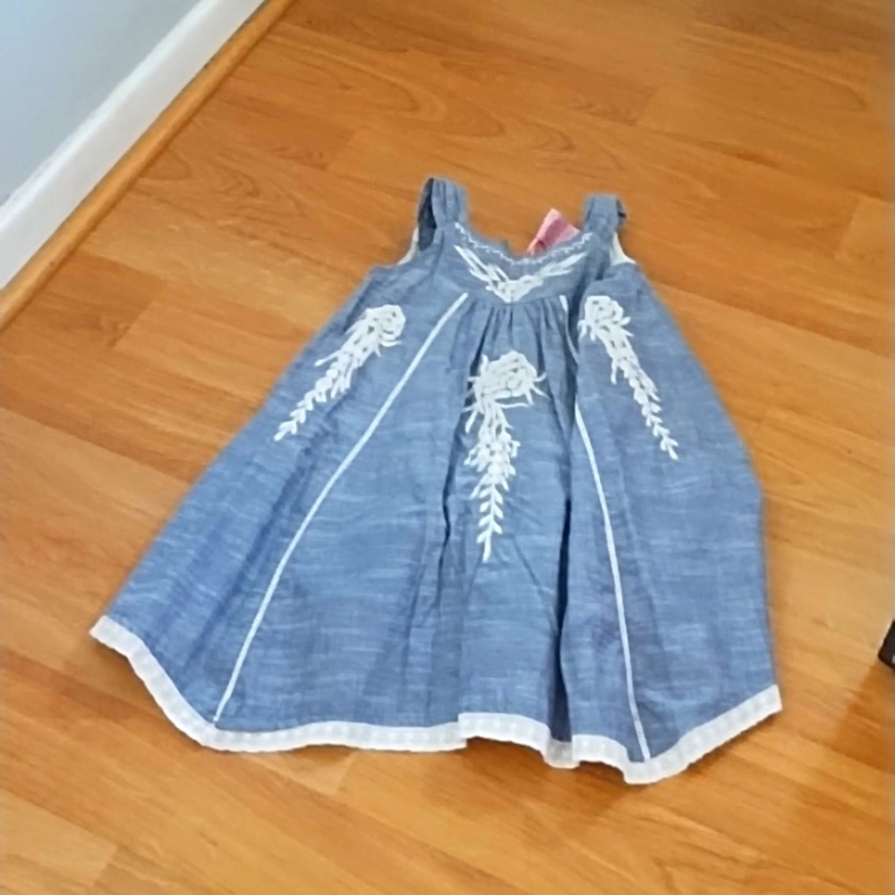 Cutie couture embroidered dress.